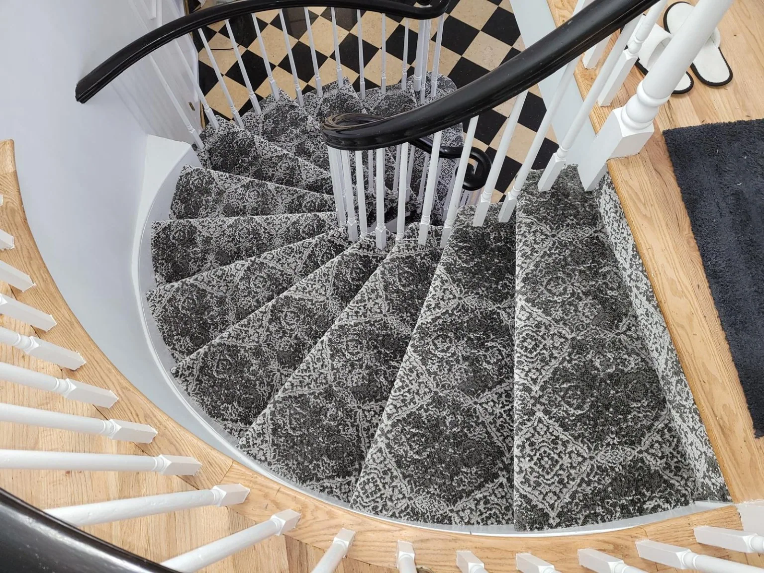Custom carpet fitted to sweeping curved residential staircase