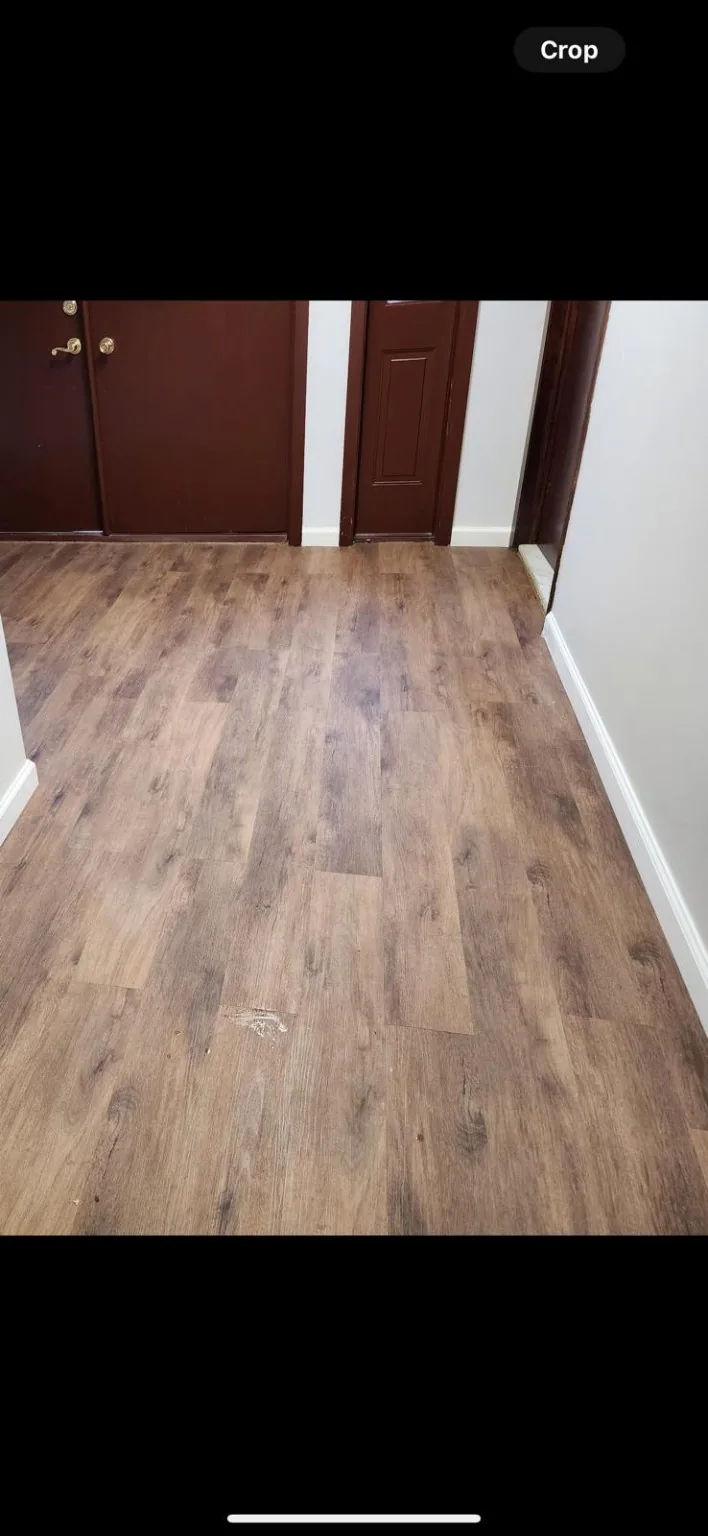 Warm wood-look flooring in residential hallway